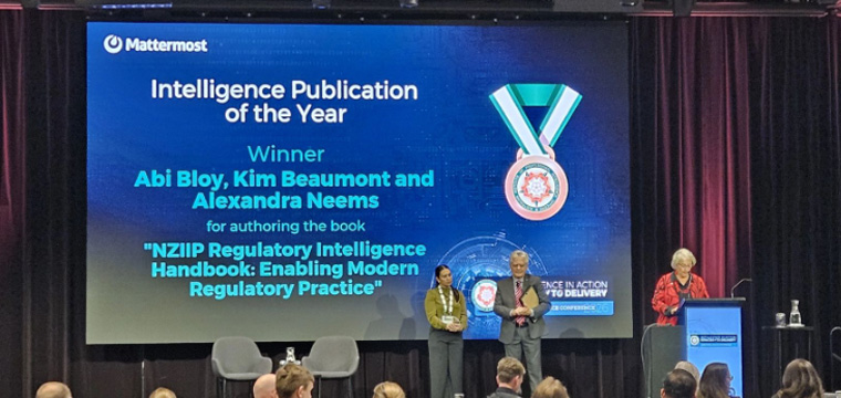 Kim receives her award.