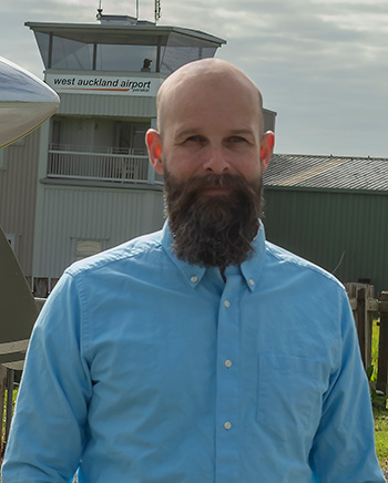 Simon standing in front of control tower