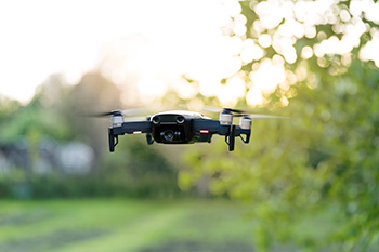 Floating drone near greenery