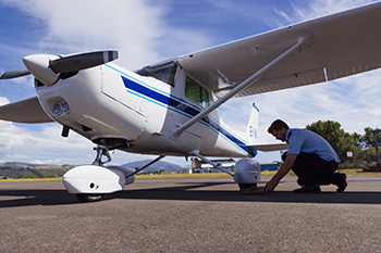 Pilot preflight on runway