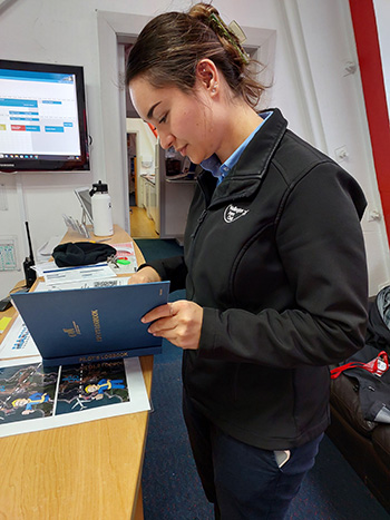 Pilot reading a logbook