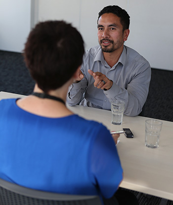 Two people in an interview.