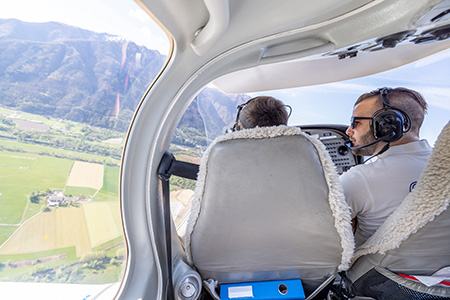 View from cockpit over mountainous terrain