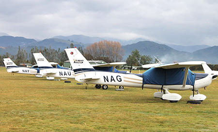 3 small parked planes