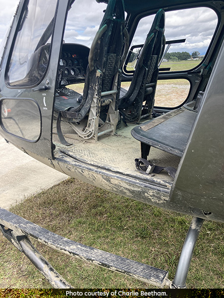 Helicopter covered in mud.