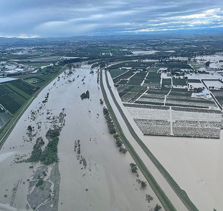 Flooded river and paddocks.