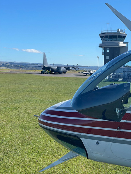 Helicopter with Hercules and tower in background