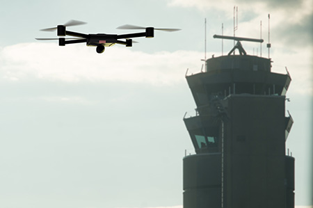 Drone with control tower in the background