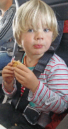 Little boy in child restraint